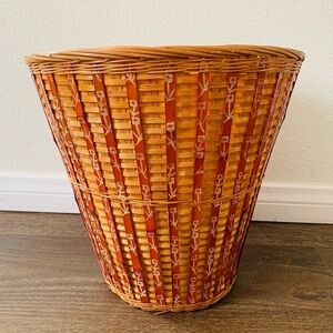 Handwoven light basket with red vertical striped pieces